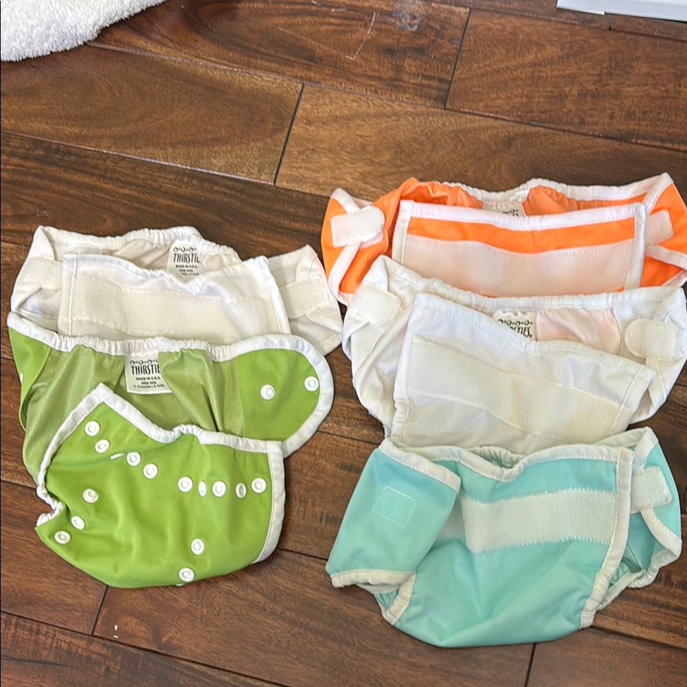 Lot of 5 Thirsties cloth diaper covers. And 2 hemp inserts